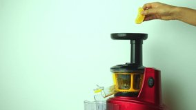 Auger juicer screw making oranges vegetable juice