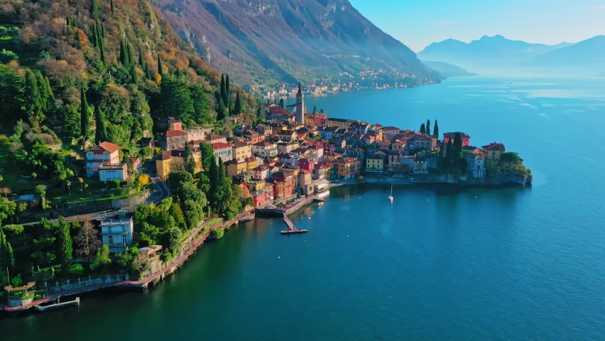 Panorama of Varenna by Lake Como in Italy, aerial view of the old town with the church of San Giorgio in the central square | Shutterstock HD Video #1059310142