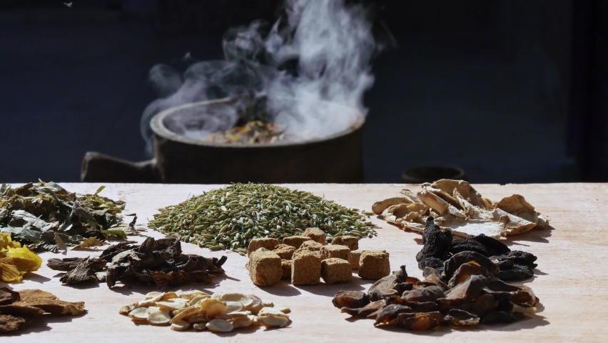 Chinese herbal medicines on table, herbs boiled in medicine jar Royalty-Free Stock Footage #1059310184