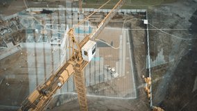 Yellow crane in construction site with statistical graphics animation for production trend and control of workers team. Potential investiment income calculator. Aerial drone footage - Powered by Shutterstock - Get 15% off with code: PIKWIZARD15