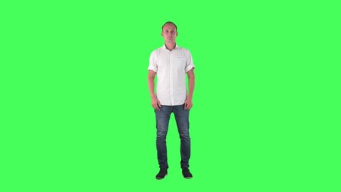 Business man talking and announcing looking at camera. Full body on green screen. 