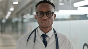 Portrait of Professional Young Male African Doctor doing Video Chat