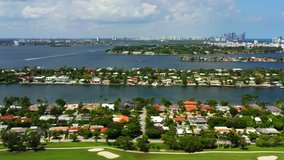 Aerial fast pan Miami Beach Normandy Shores neighborhood view of bay and ocean
