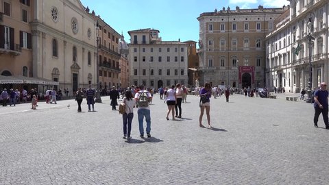 Rome, Piazza Navona, Fontana del Moro people sightseeing. Rome Italy May 2019