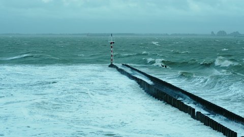 Sea waves crashing through breakwater / Vlissingen, Zeeland, Netherlands