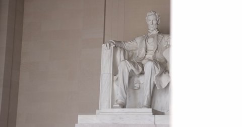 Tracking shot of Abraham Lincoln statue at the Lincoln Memorial in Washington DC