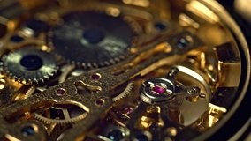 Gold vintage watch mechanism working macro (looped video)