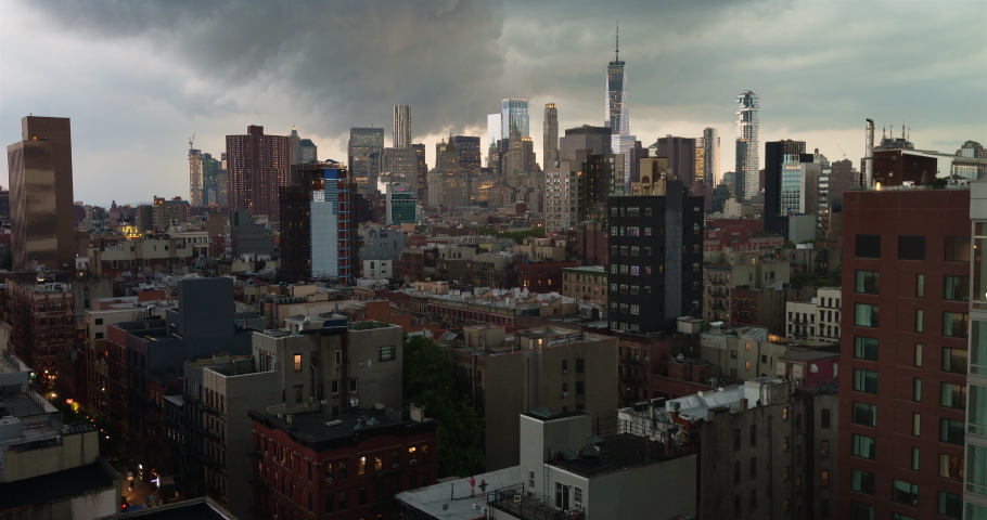 Storm over cityscape seen from Lower East Side looking at Freedom tower / New York City, New York, USA