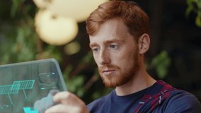 Face red-haired entrepreneur using holographic tablet computer internet businessman digital handsome connection communication browsing social media user interface inside cafe interior slow motion - Powered by Shutterstock - Get 15% off with code: PIKWIZARD15