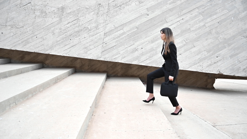 Businesswoman wearing heels climbing the Stairs in the city. High quality 4k footage .