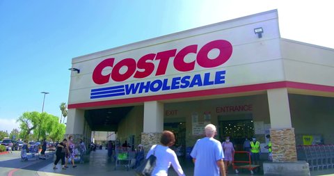 LOS ANGELES, CALIFORNIA, USA - SEPTEMBER 21, 2020: Membership customers coming in to Costco wholesale storefront warehouse in Los Angeles, California, 4K