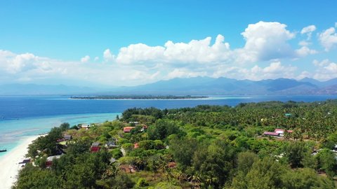 tropical Gili Island in Lombok, aerial panorama, sky and mountains in the background