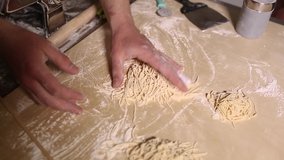 Chef cook makes traditional Italian pasta in restuarant kitchen,filmed in close up