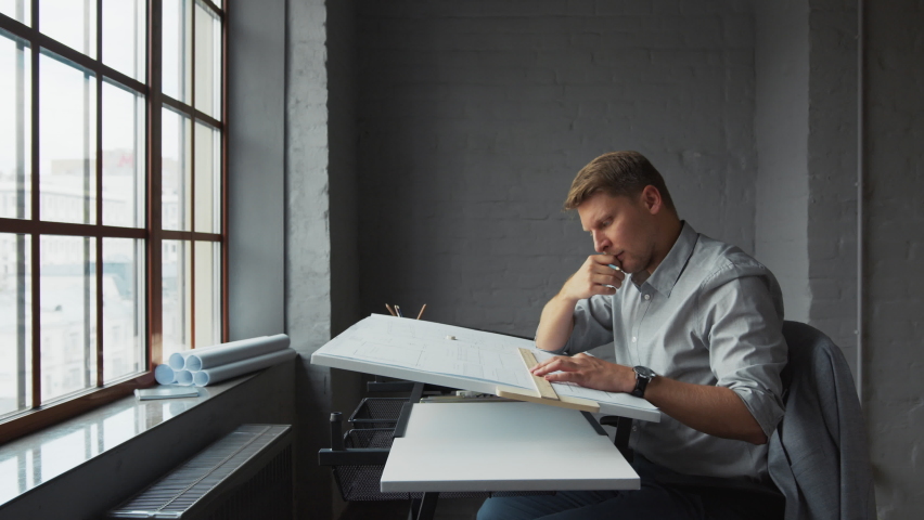 Thinking young businessman at work in the office