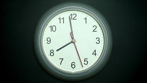 Slow motion clock isolated on black background, Showtime 07.58 am or pm, Clock Red second hand minute Walk, Time concept.