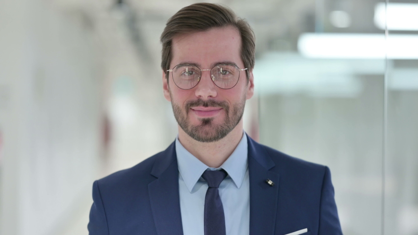 Assertive Young Businessman with Pointing at the Camera