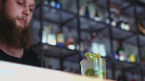 Barman Preparing A Mojito In A Cocktail Bar.