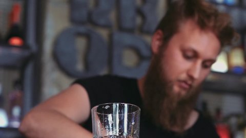 Barman With Beard Preparing A Mojito In A Cocktail Bar.