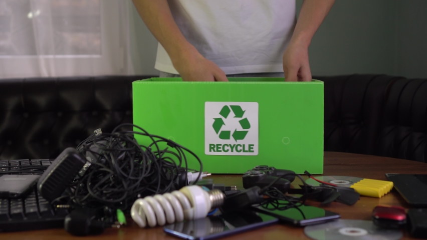 E-Waste Recycling. Electronic waste, also called e-waste, old used electric and electronic equipment. Wires, smartphone, mobile phone, pc. Recycle box, recyclable materials | Shutterstock HD Video #1059465776