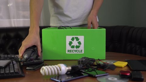 E-Waste Recycling. Electronic waste, also called e-waste, old used electric and electronic equipment. Wires, smartphone, mobile phone, pc. Recycle box, recyclable materials
