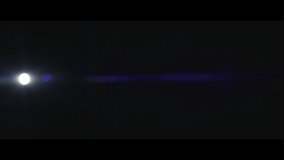A blue spherical lens flare moving from the left side to right side over a black background captured using a 100mm anamorphic lens from the Lucent Panorama collection - Lens Flare Video Element.