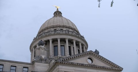 Close up, dome and roof: Stormy skies over the Mississippi State Capitol building. Jackson, MS.