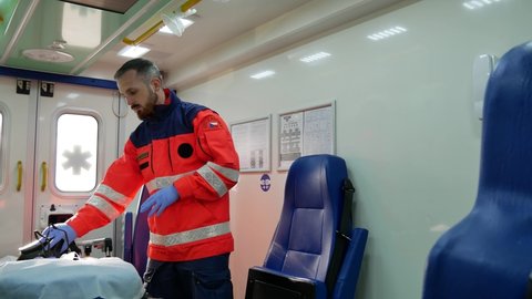 Czech Paramedic is putting off the gasmask in the ambulance