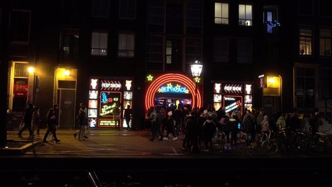 AMSTERDAM, NETHERLANDS - SEPTEMBER 23, 2020: Nightlife in Amsterdam Red Light District