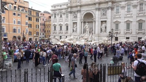 Rome, Piazza di Trevi, Fontana di Trevi, people sightseeing. Rome Italy May 2019