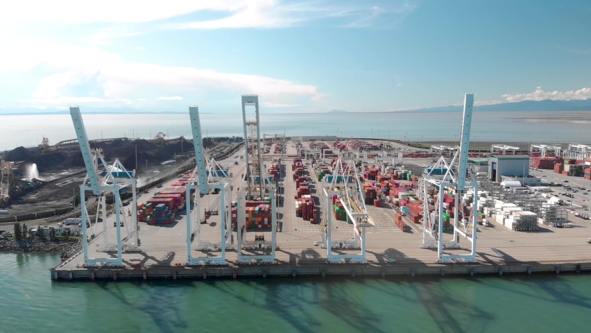 Aerial drone footage of a cargo terminal with cargo ships in Vancouver, BC, Canada. 4K. | Shutterstock HD Video #1059485885