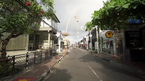 Bali, Indonesia - CIRCA 2020: Driving in Seminyak - Eerie Empty Streets, Business Closures, Tourism Economic Impacts due to COVID-19 Coronavirus Pandemic Lockdowns