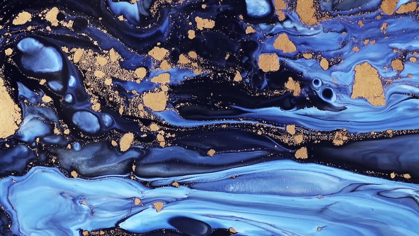 Fluid art drawing video, trendy acryl texture with flowing effect. Liquid paint mixing backdrop with splash and swirl. Detailed background motion with blue, golden and navy blue overflowing colors. Royalty-Free Stock Footage #1059503468
