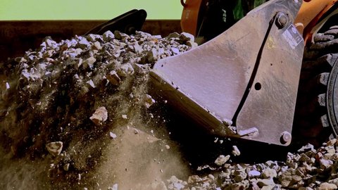 Bulldozer pushing gravel on a construction site