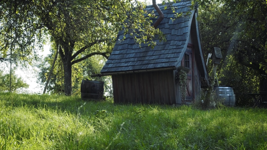 Fairy Tale Fairytale Witch House (Hexenhaus) Hansel Greetel Gingerbread House, Fruit Trees in Background on a Green Meadow in  late Summer Sunshine, Sun  shining,  Camera Panning Left to Right (LTR) | Shutterstock HD Video #1059504188