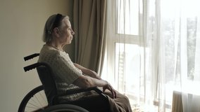 Disabled elderly woman on wheelchair - Powered by Shutterstock - Get 15% off with code: PIKWIZARD15