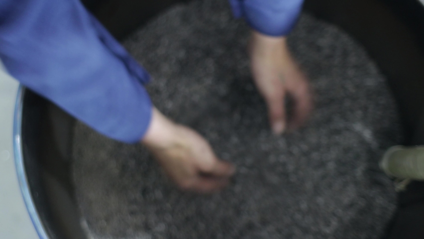 Man hand holding PP Pet Chips Semi Dull, PET chips recycle, PET polyester chips | Shutterstock HD Video #1059507026
