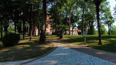 Capriva del Friuli , Friuli Venezia Giulia / Italy - 07 16 2019: Cobblestone path approaching the Castello di Spessa residence resort