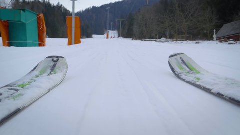 pov shot from skis going up the lift. Slowly moving the camera up. Cloudy winter day. Slovenia