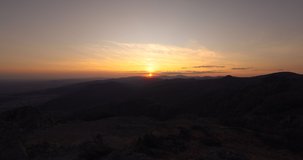 Aerial panoramic view of sunset over mountain hills