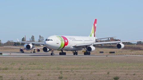 LISBON, PORTUGAL - 2020: TAP Air Portugal Airbus A340-300 Jet Airliner Close-up Taxiing Turning onto Runway Departing Lisbon Humberto Delgado Portela International Airport Ground on a  Sunny Day
