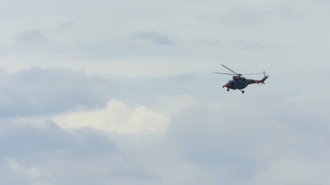 Helicopters doing maneuvers at air show in Gdynia