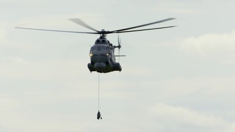 Helicopter doing maneuvers at air show in Gdynia