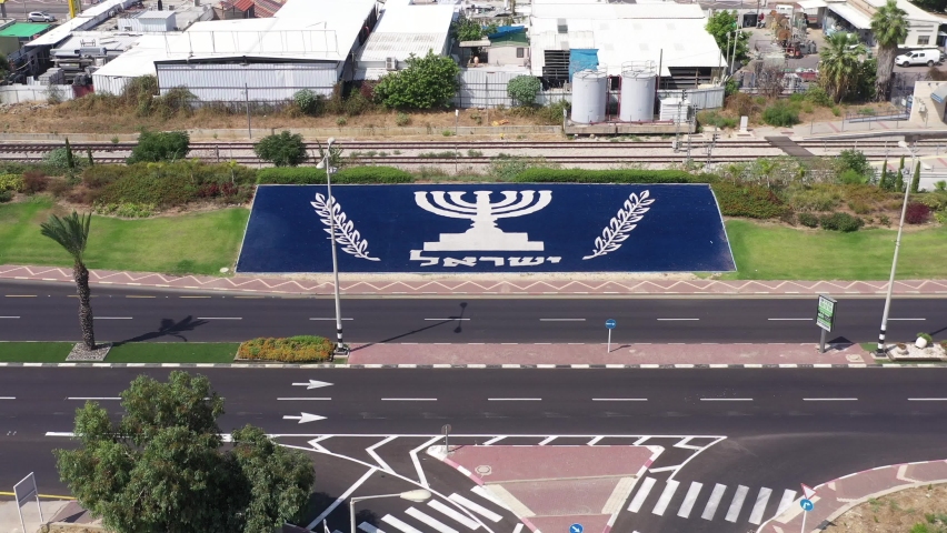 Corona Virus second lockdown, empty highway road with large national Menorah of Israel, south of the city of Nahariyya, Aerial view.