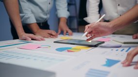 Millennial Asian businessmen and businesswomen meeting brainstorming ideas about new paperwork project colleagues working together planning success strategy enjoy teamwork in small modern night office. - Powered by Shutterstock - Get 15% off with code: PIKWIZARD15