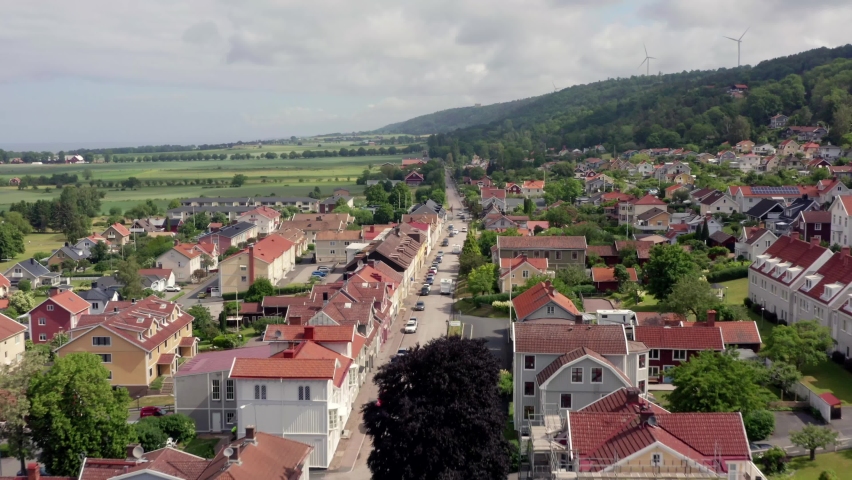 Drone shot of Granna village in Sweden. Aerial view over small swedish town at countryside in summer. Polkagris stores along the road Royalty-Free Stock Footage #1059533087