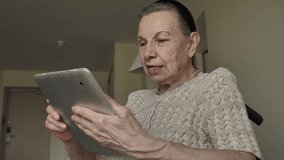 Senior woman communicates via video chat