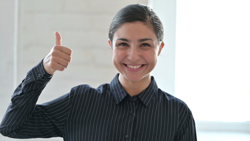 Portrait of Positive Young Indian Woman doing Thumbs Up  | Shutterstock HD Video #1059539714