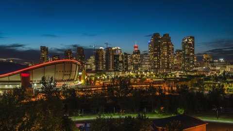 Day to night timelapse view of Calgary skyline showing high rise buildings in the financial district, Calgary, Alberta, Canada. 