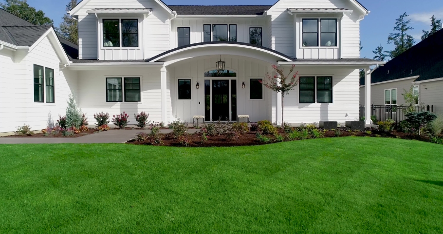 Beautiful white farmhouse style luxury home. Video moves upward. | Shutterstock HD Video #1059542807