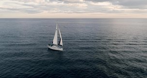 Aerial video with sailboat drone in the Mediterranean at sunset_Spain